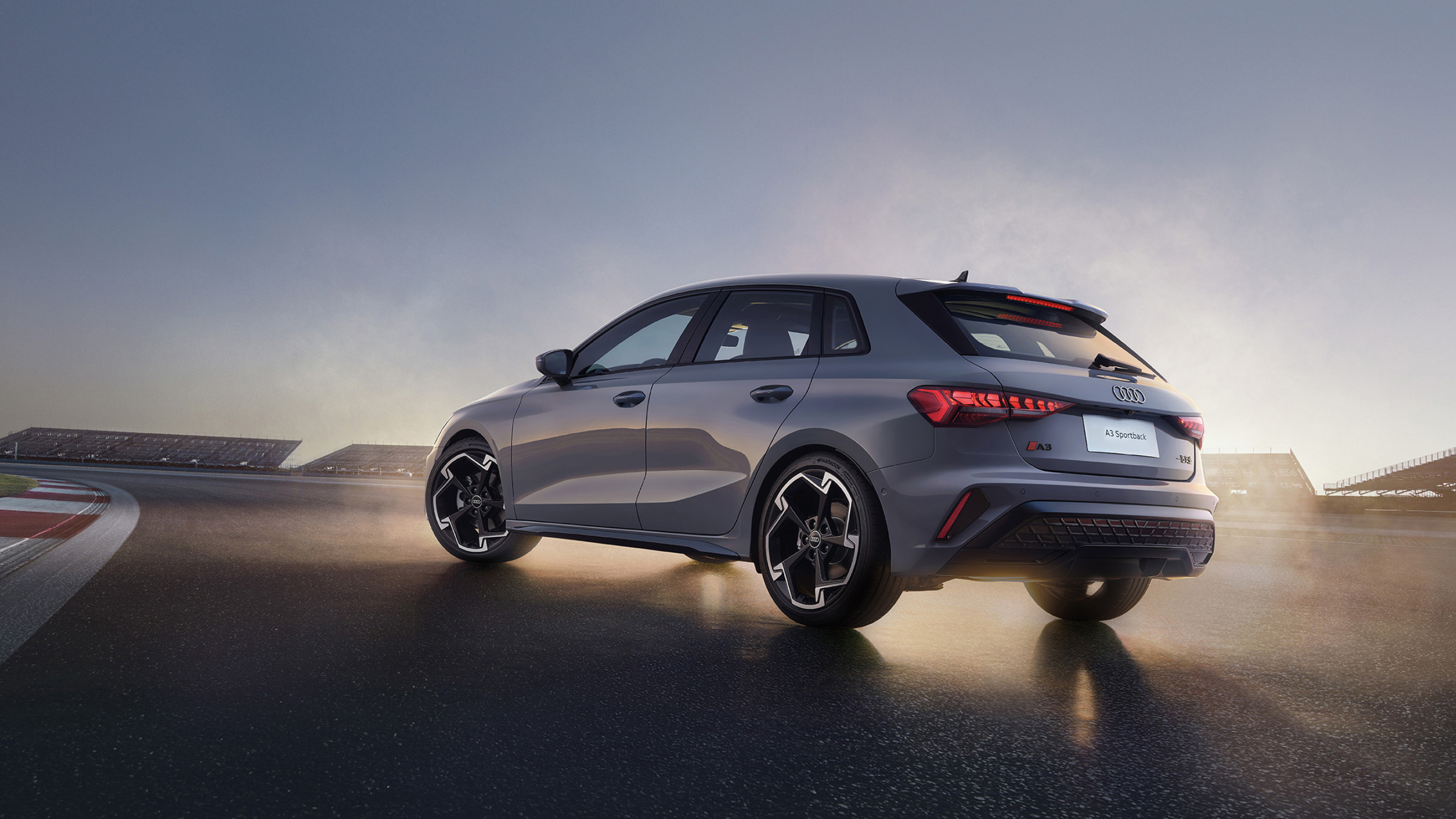 Grey Audi A3 Sportback on a circuit at sunset; official Audi China image, candidate condition not implied